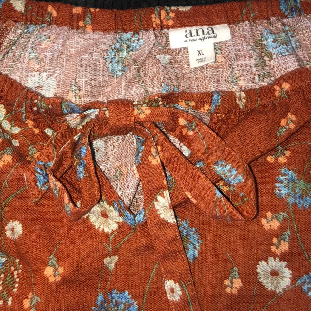 Floral loony sleeve shirt with front bow.